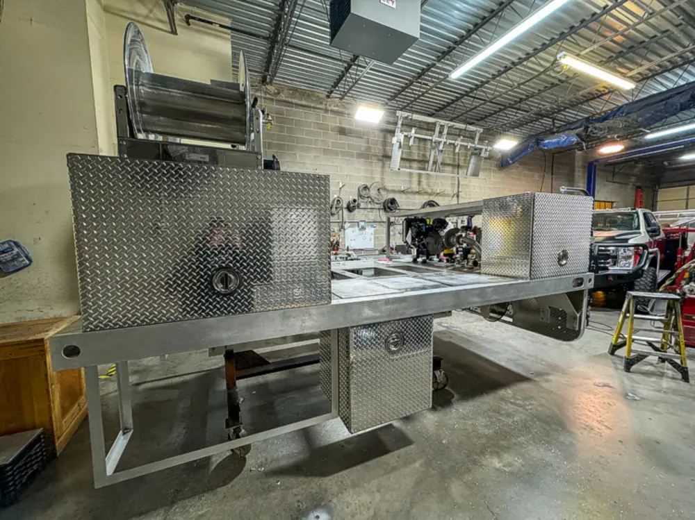 Engine and hose connection hardware detail, photo 149 of 303.